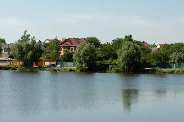 private houses over lake in the forest