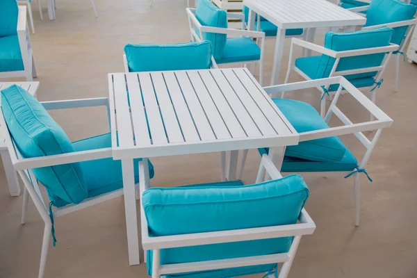 chairs and tables in beach restaurant