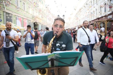 19.06.2018. Moscow, Russian: Fans of Colombia, Mexico, Poland dancing and singing for the roads of the center of Moscow during Fifa World Cup Russia 2018. clipart