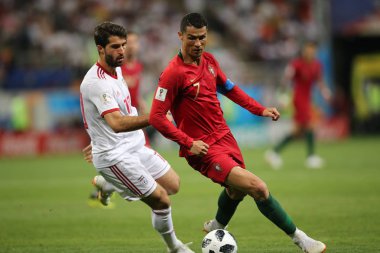 25.06.2018. Saransk, Rusça: Karim Ansarifard, Cristiano Ronaldo FIFA Dünya Kupası Rusya 2018, B grubu, futbol sırasında eylem Iran V Portekiz Mordovia Saransk Arena Stadyumu arasında eşleme.