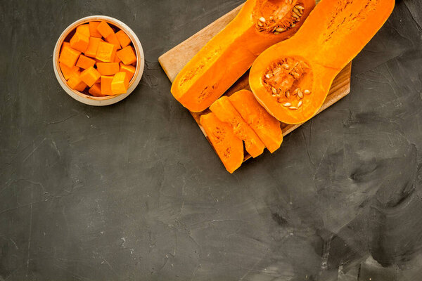Pumpkin - butternut squash sort - on grey table top view copy space