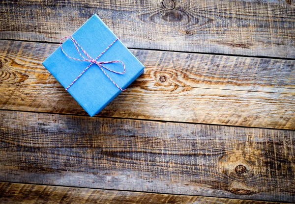 Blue gift box on wooden background — Stock Photo, Image
