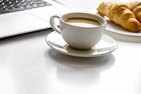 Office breakfast with laptop on white desk — Stock Photo, Image