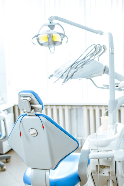 Vertical view of a dentist room with blue seat