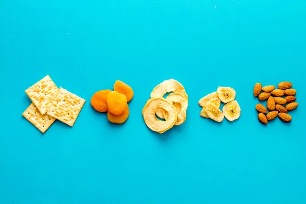 Mix of snacks - nuts and dried fruits, flat lay, top view