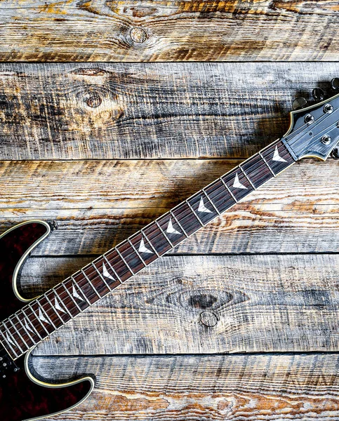 Electric guitar on wooden background vintage look — Stock Photo, Image