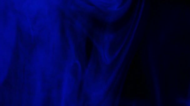 images en gros plan de fumée colorée sur fond sombre