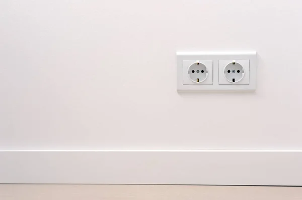 electrical outlet on white wall. home design