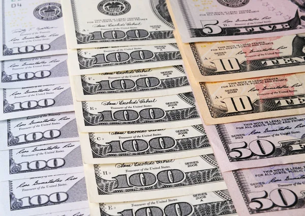 US american dollar money bills spread on white background