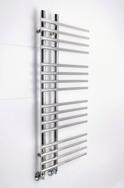 Heated towel rail in the bathroom. Towel warmer in bathroom.