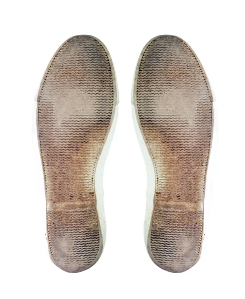 Dirty sole of shoes on a white background