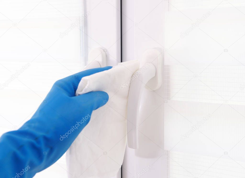 The workers hand wipes the window. Maid or housewife takes care of the house. Spring general or regular cleaning. The concept of a commercial cleaning company