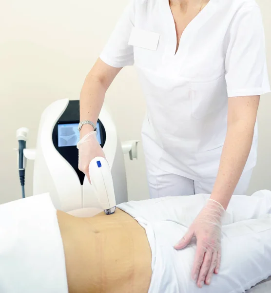 Woman gets laser and ultrasound treatment of face and body at medical spa, skin rejuvenation concept. Hair laser removal service. IPL cosmetology device. Professional apparatus. Woman soft skin care.