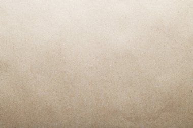 Arka plan olarak bej rengi geri dönüşümlü kağıt dokusu. Kahverengi kağıt dokusu, eski kağıt grunge arkaplanı, eski moda sayfa ya da grunge vignette ambalajı. Boş arkaplan.