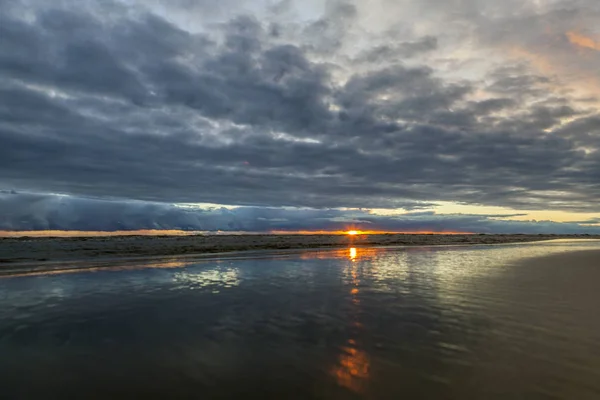 Colorful the sea sunset with  orange-violet paints