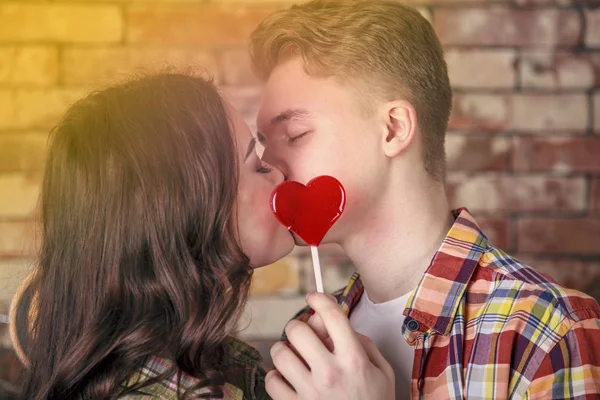 Young Loving Couple Kiss Each Other Cover Lips Candy Form — Stock Photo, Image