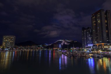  China, Hainan Island, Sanya bay - December 2, 2018: Night panorama of Sanya city, view from the bridge to the bay, editorial.