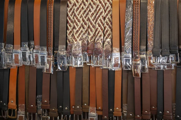 men\'s belts. Leather belts with various colors on sale in an Vietnamese market in Hue.