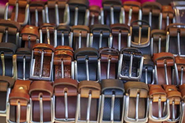 men\'s belts. Leather belts with various colors on sale in an Vietnamese market in Hue.
