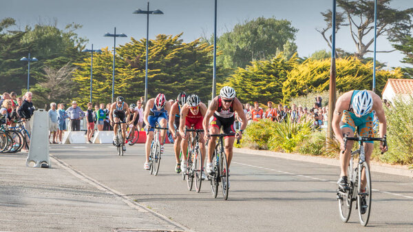 Saint Gilles Croix de Vie, France - September 10, 2016 : Final triathlon championship of France in the category D3 - cyclists straight for a road bike race