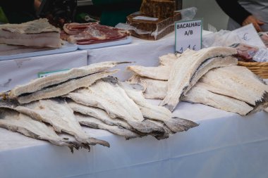 Quarteira, Portugal - May 2, 2018: display of salted and dried cod on the municipal market of the city on a spring day clipart