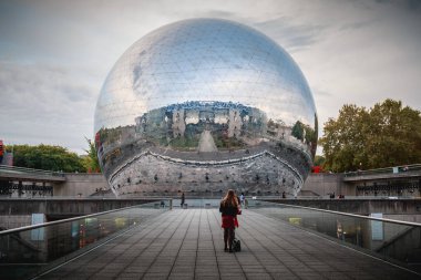 Paris, France - October 6, 2018: people who walk in front of the dynamic cinema of Geode during the feast of science at the city of scences and industry clipart