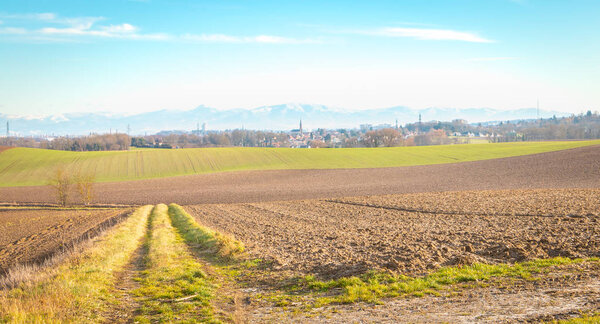 view of a field in the countryside near the Vosges mountains and the town of Morschwiller le Bas in France