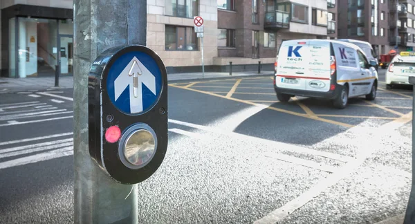 button to activate pedestrian crossing on the road in Dublin
