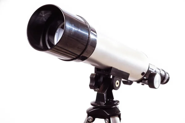 Telescope on a white background laid on wooden board — Stock Photo, Image
