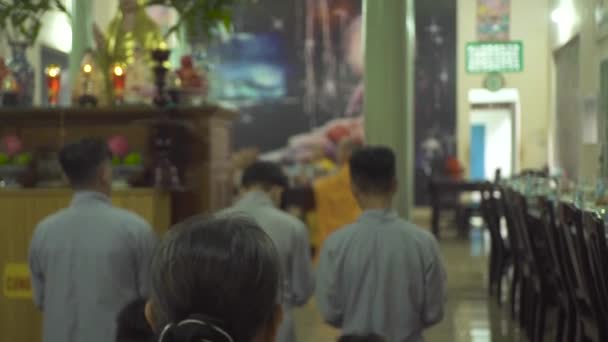 Hanoi, Vietnam - july, 2018: Buddhist monks praying in Buddhist pagoda. Religious monks during prayer in sacred Buddhist temple. — Stock Video