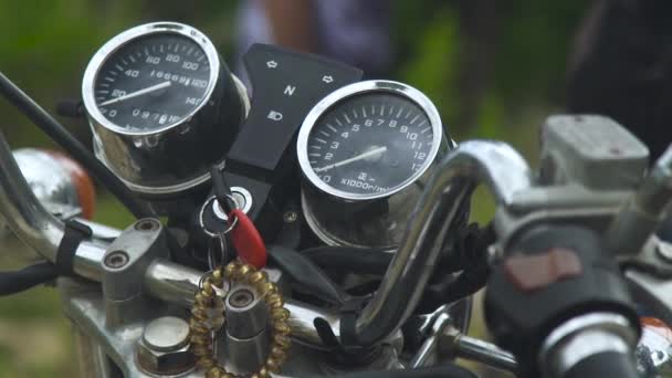 Speedometer, odometer and ignition key on motorcycle dashboard. Close up control panel motorcycle. — Stock Video