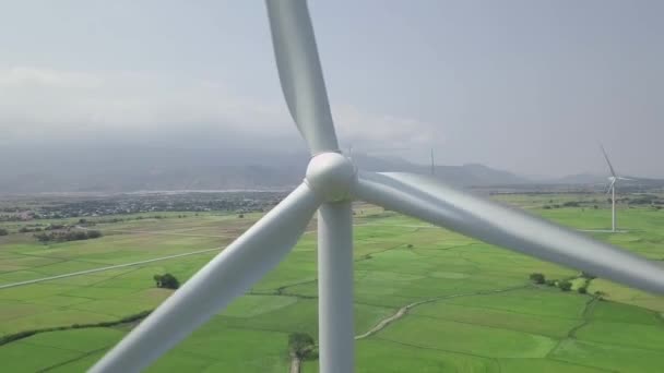 Wind power turbines aerial view. Windmill turbine generating clean renewable energy in green agricultural field aerial landscape. Wind energy station. Ecology and nature conservation. — 비디오