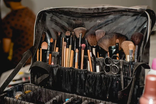 makeup brushes in makeup artist bag