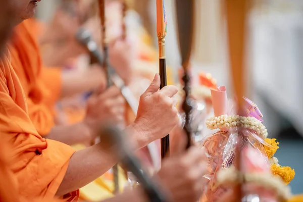 Closeup of monk\'s hand with pray on ceremony of Buddhist in Thailand