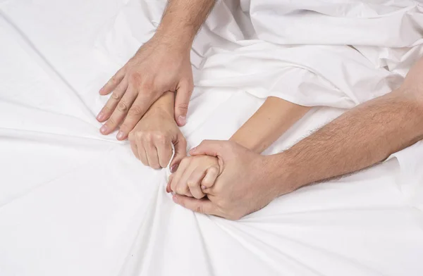 Close up hands of a couple make love hot sex on a bed — Stock Photo, Image