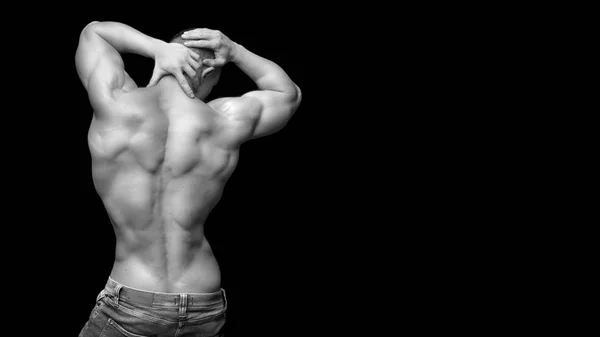 Isolated black and white muscle man. Back view. — Stock Photo, Image