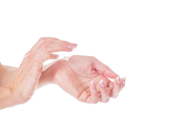 Beautiful young woman hands with cream, isolated on white — Stock Photo, Image