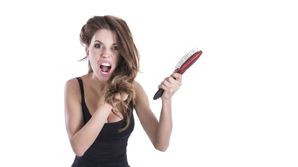 Bad hair day, portrait girl with messed up hair isolated on white background. Frustrated woman. Caucasian girl looking in despair and panic. hair strength concept.