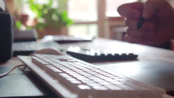 Man searching information with pc touch pad. Male fingers is typing on touchpad of black laptop with english keyboard. Selective focus — Stock Video