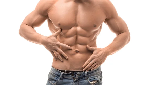 Torso masculino muscular isolado em branco. Homem sem camisa de mandíbulas azuis tocando seus abdominais — Fotografia de Stock