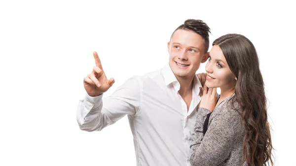 Mann zeigt seiner geliebten Frau etwas isoliert auf weißem Hintergrund mit Kopierraum — Stockfoto