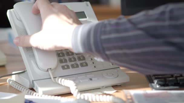 The analog phone is extremely close-up. The sales manager dials the number. — Stock Video