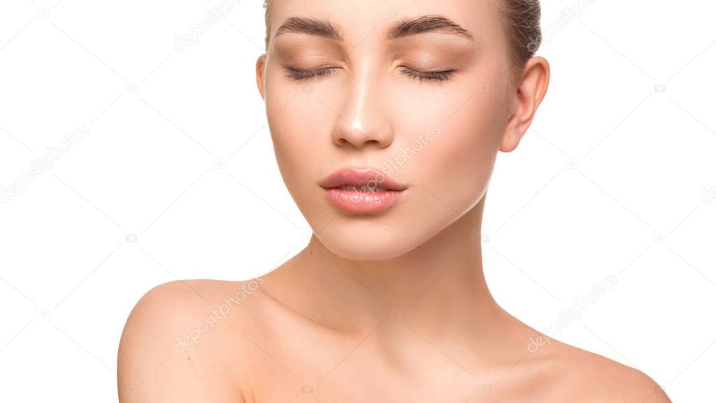 Portrait of beautiful young woman with closed eyes. Pure, natural skin. Isolated on white. Skin care and woman health concept
