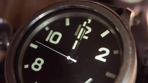 The movement of the hands of a wristwatch. The movement of the hands of a quartz wrist watch. Close up — Stock Video