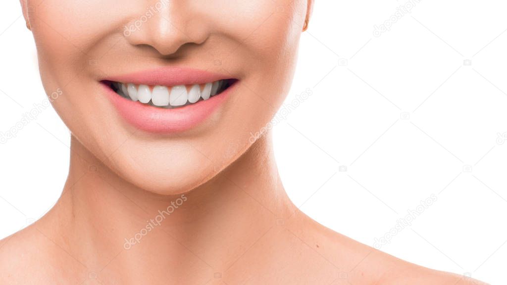 Close up photo of a woman smiling. Teeth whitening and dental health.