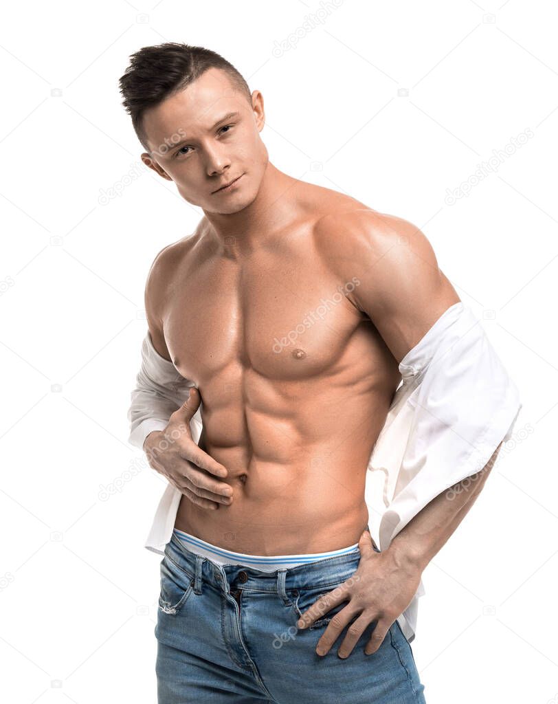 Portrait of a sexy young man in a blue jeans - isolated on white background.