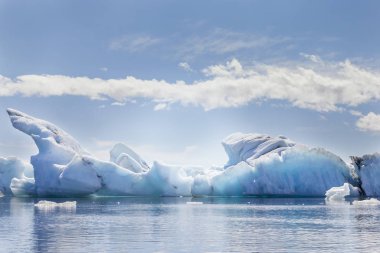 jokulsarlon blue lagoon panorama with icebergs melting in the waters clipart