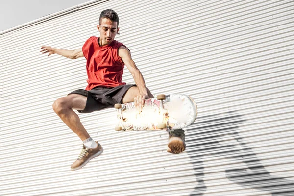 Young Skateboarder Jumps His Board Front Metal Background Roofs Abandoned — Stock Photo, Image