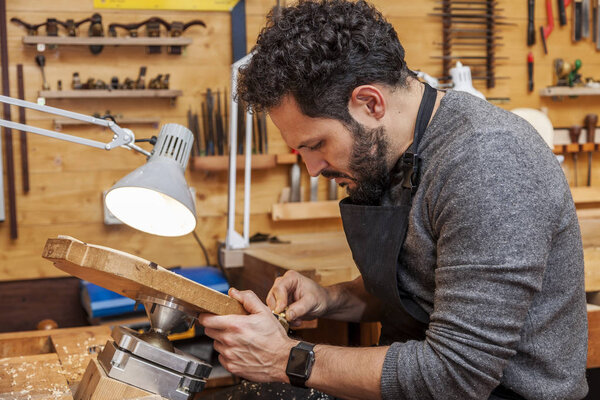 craftsman violinmaker began working on a new violin in his workshop