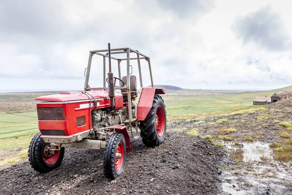 old tractor parked on a hill in the desolate lands of iceland